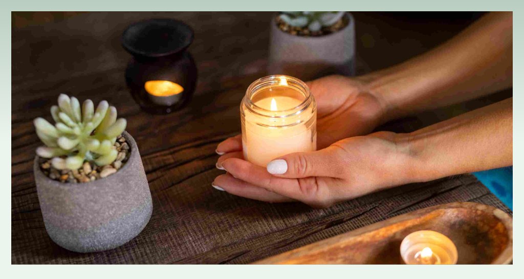 serene-scene-hands-holding-candle-how-to-start-a-candle-business