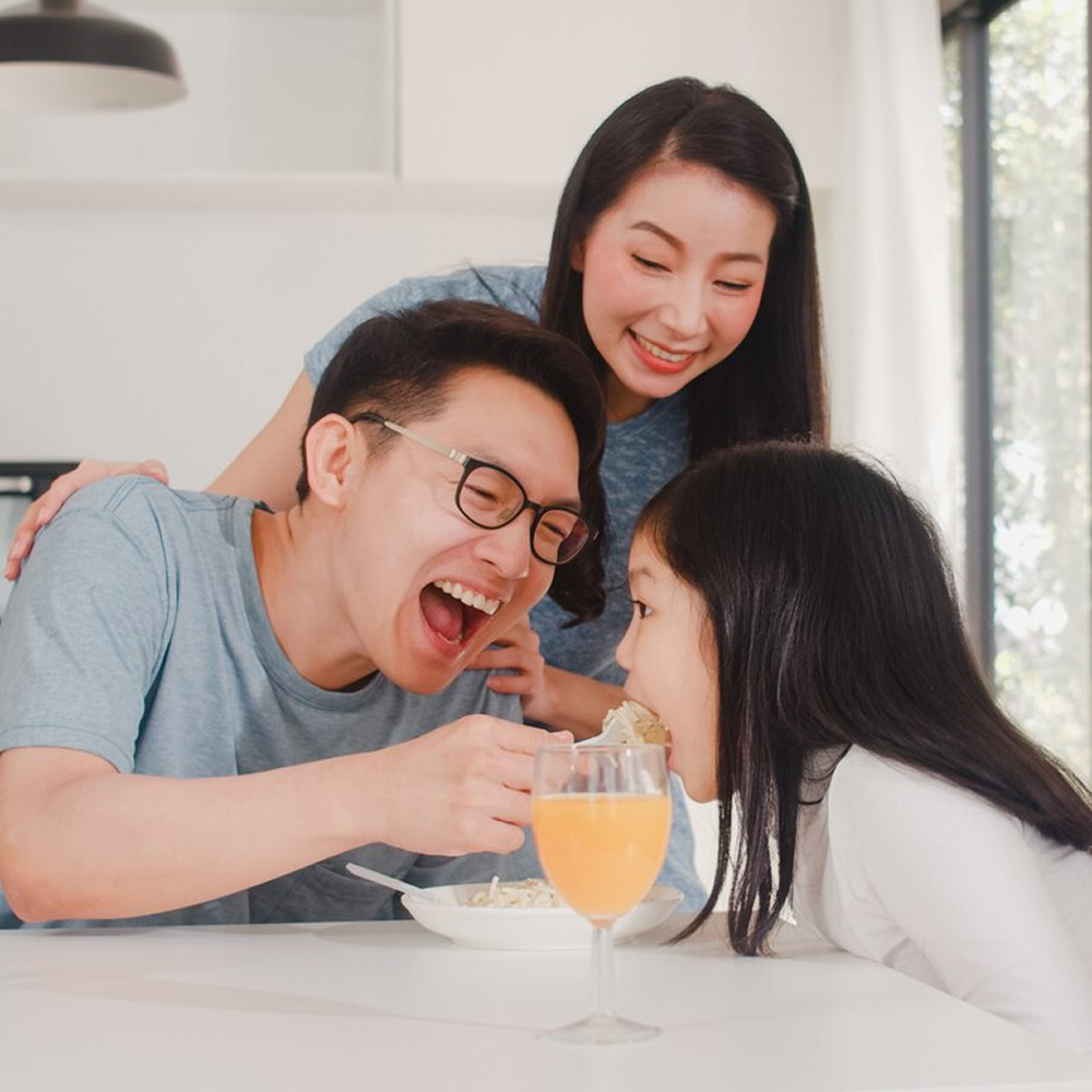 asian-japanese-family-has-breakfast-home-asian-happy-dad-mom-daughter-eat-spaghetti-drink-orange-juice-table-modern-kitchen-house-morning_7861-2251 1